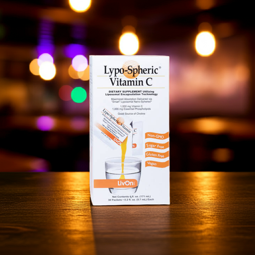 Lypo-Spheric vitamin C -Standing on a wooden table, in the background is a late night bar scene with a bokeh effect. Soft focus. Natural warm light.